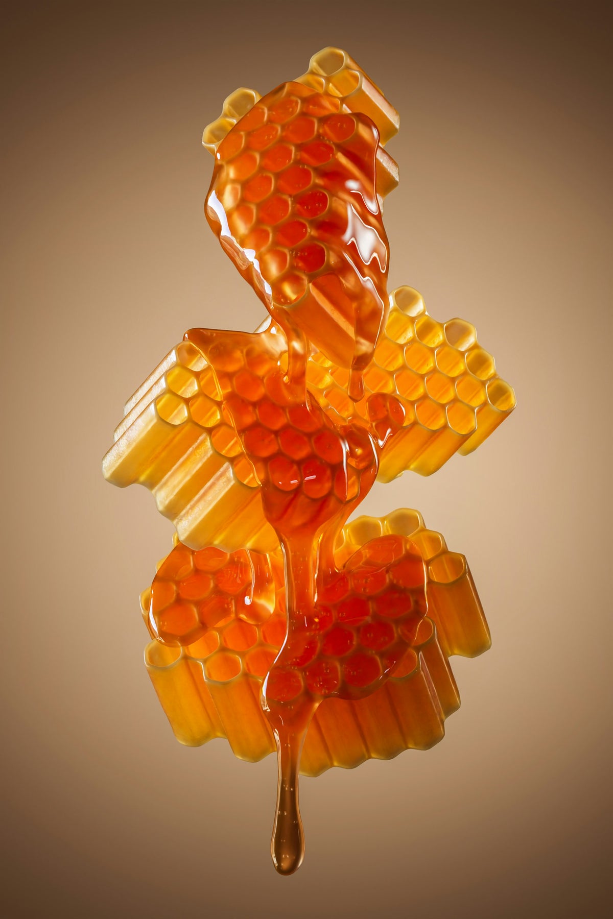 Honey dripping onto honeycomb